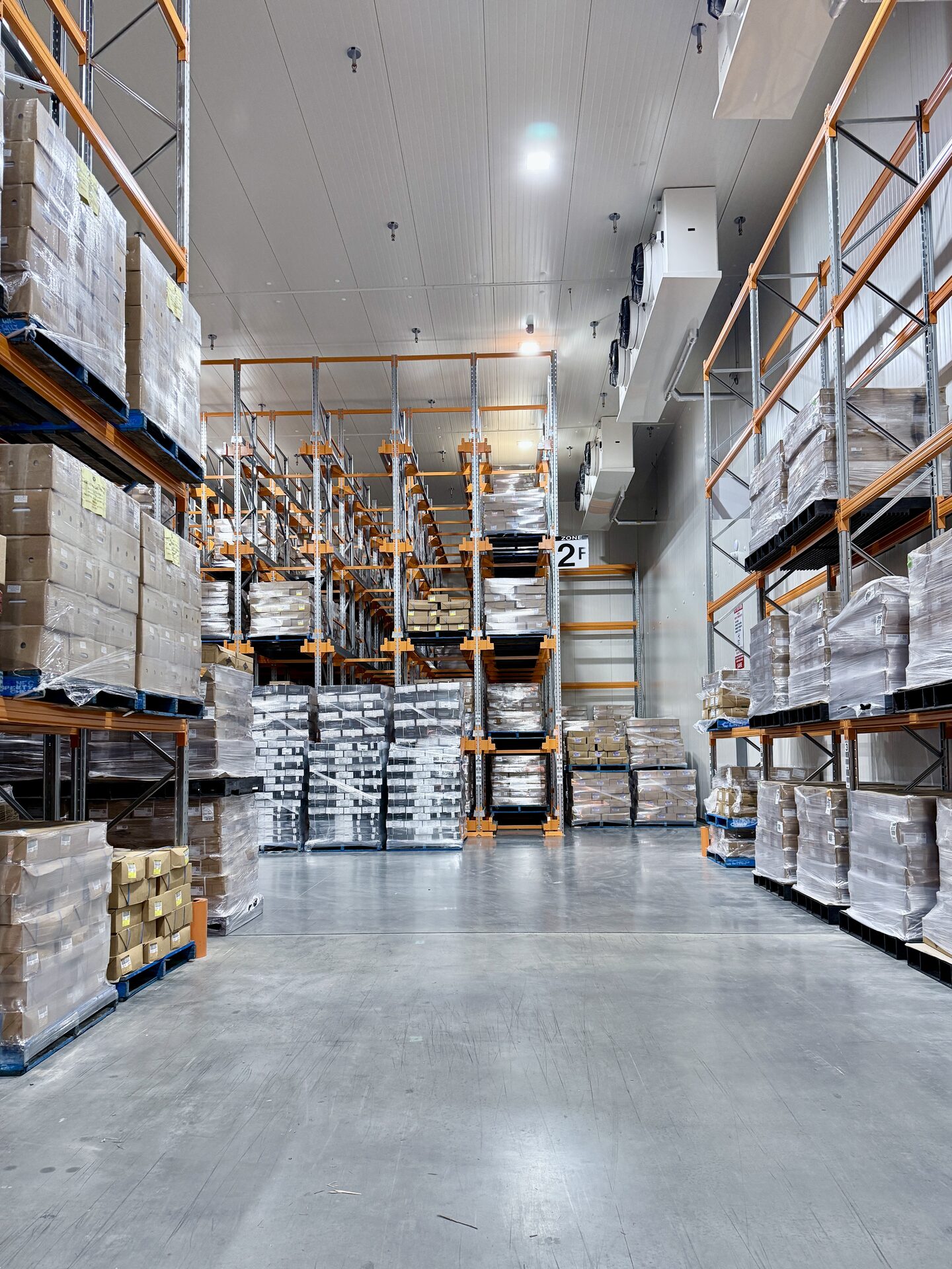 Multi-temperature cold storage warehouse aisle with high-density pallet racking at Midfield Cold Storage, Adelaide